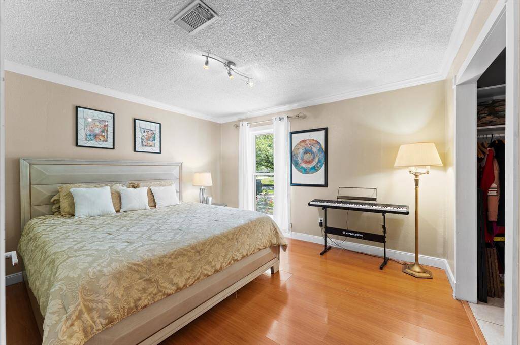 bedroom #3 spacious and serene bedroom featuring beautiful floors, large window for natural light, and generous layout perfect for relaxation or creativity.