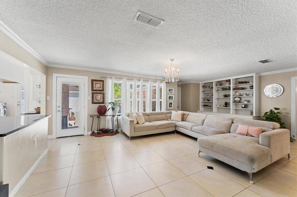The living room is bright and open, with tons of natural light and a doors that lead right out to the back yard