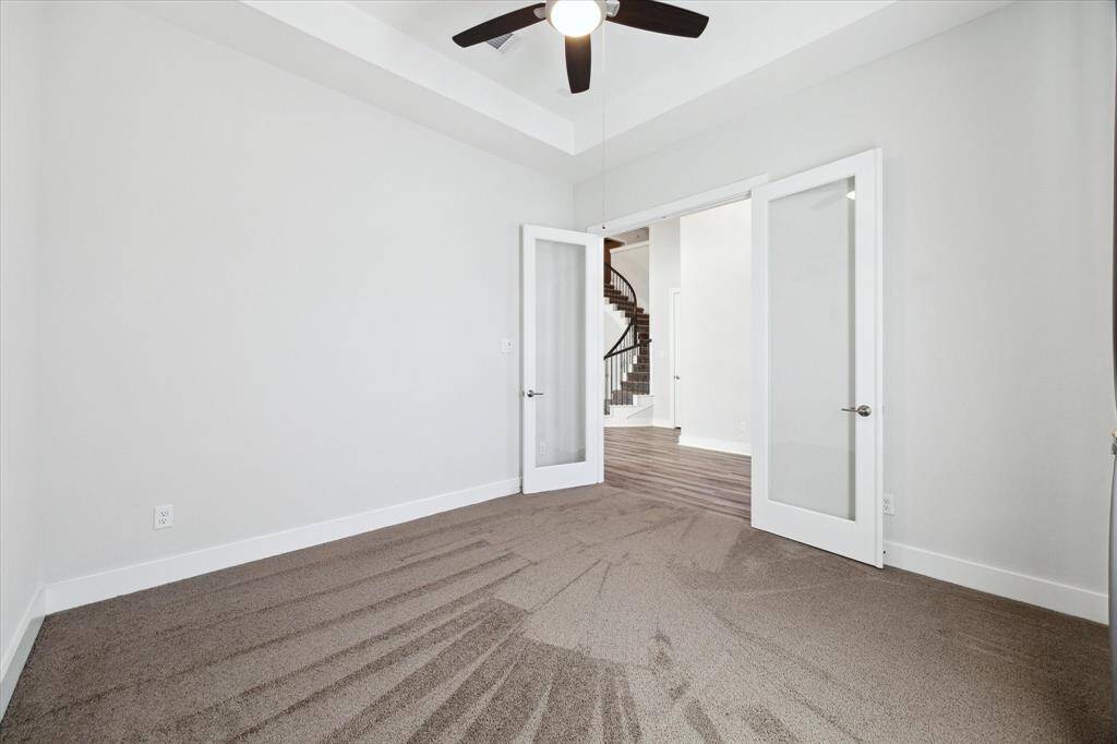 FIRST FLOOR: Study/office with double doors.