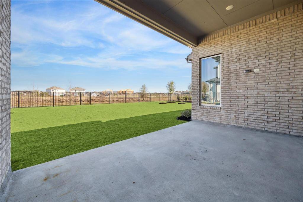 Look at this expansive covered patio and stunning view!  NO BACK NEIGHBORS!