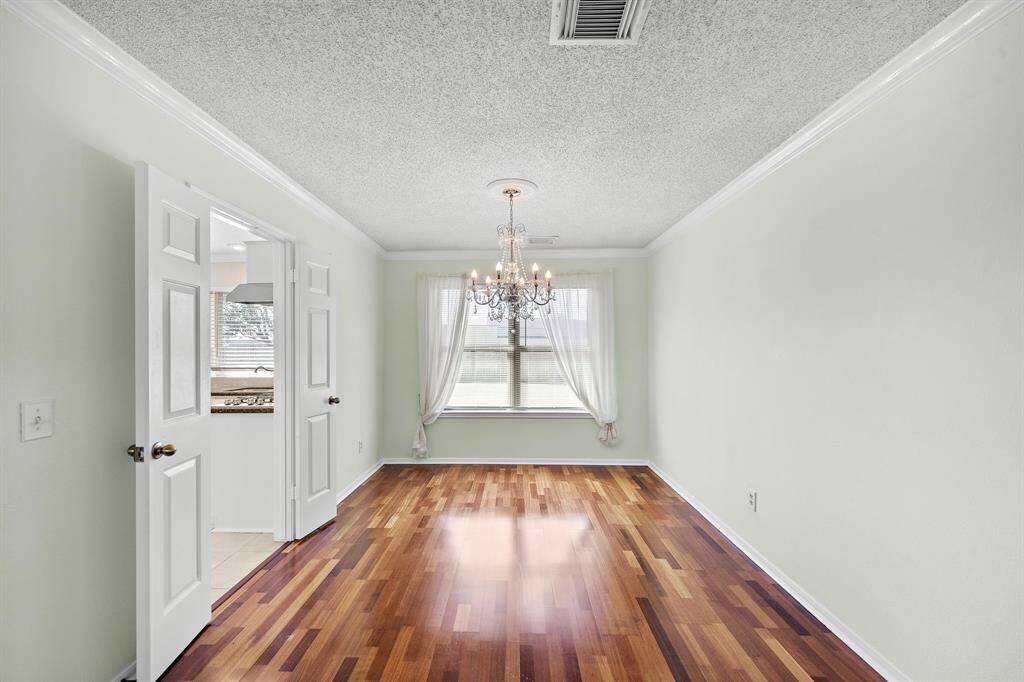 This is a bright, inviting dining room perfect for all your family gatherings.  This easy flow connects to the kitchen through double doors.