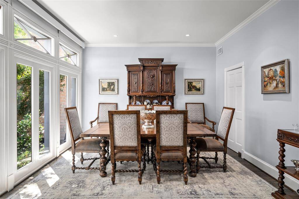 Formal dining room looks onto the atrium and has an access door to kitchen.