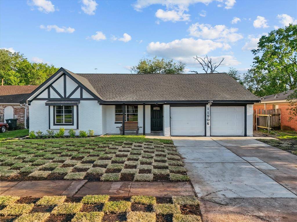 This charming home features a modern Tudor-style exterior with a fresh white and black color scheme. It has a spacious driveway leading to a two-car garage, and a newly landscaped front yard adds curb appeal. Perfect for buyers seeking a blend of classic design and contemporary updates.