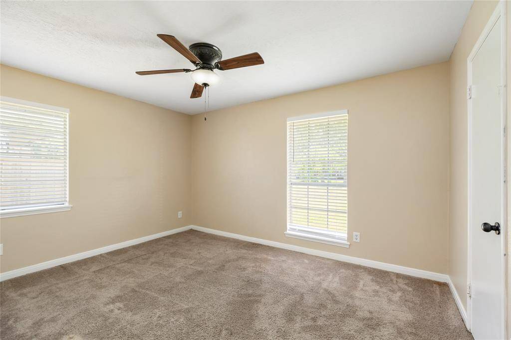 Bedroom 4 with double windows and ample natural lighting.