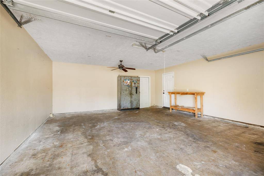 Large 2 car garage with exit to outdoor patio.