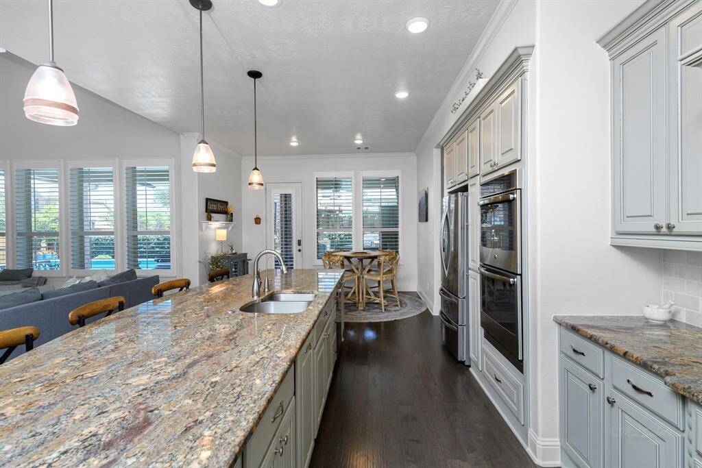 You'll love being able to cook and clean while also being able to see the fun in the living area and the backyard.