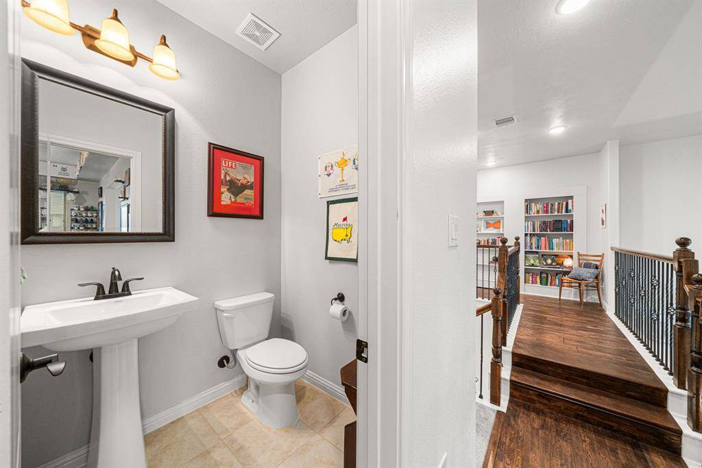 Powder room upstairs, located next to the game room and media room.