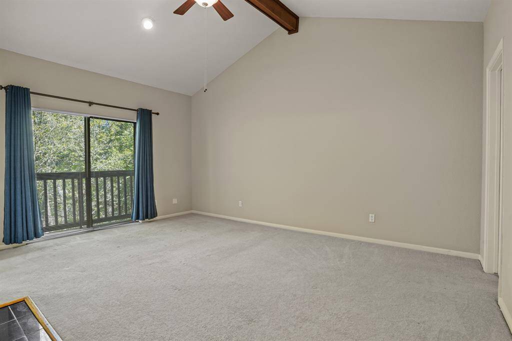 Step into the spacious primary bedroom with a cozy fireplace, high ceilings, walk-in closet and a Juliet balcony.