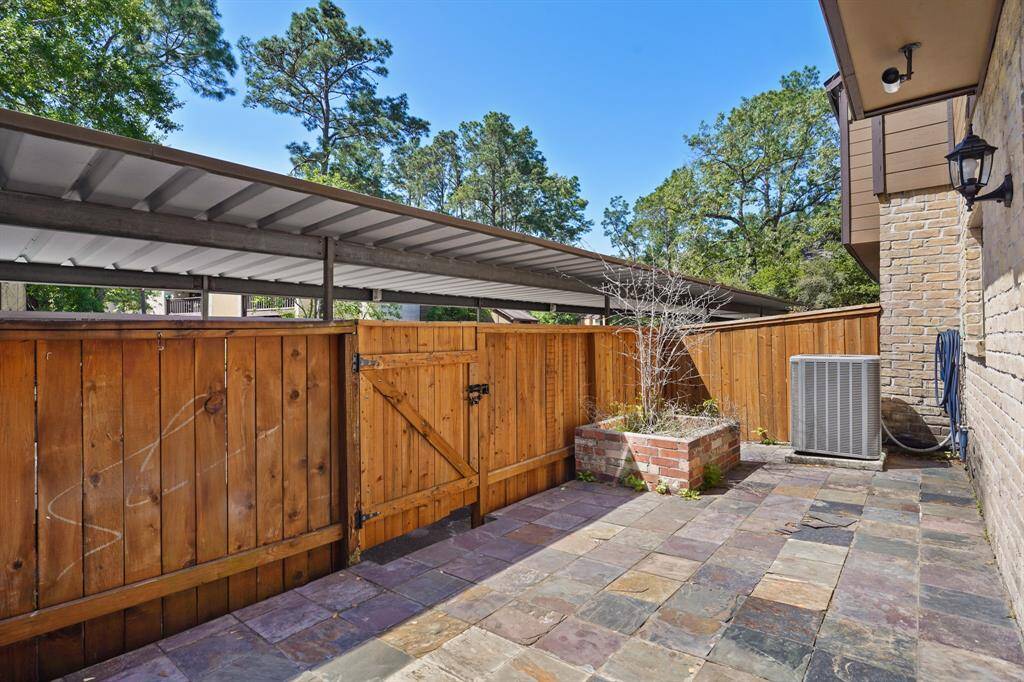 The back gate leads straight to your covered parking spot. The large patio gives plenty of space for multiple sitting areas.