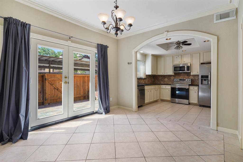 This dining room is bathed in naturallight streaming through the glass doors to the backyard.