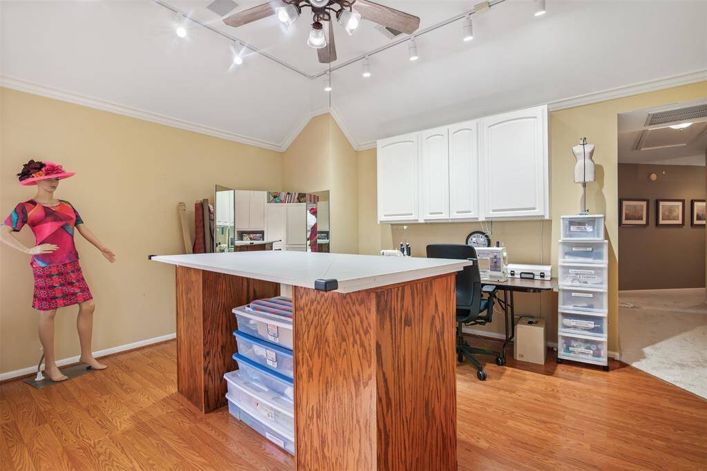 Another view of the game room which has built in wall cabinets for plenty of storage.