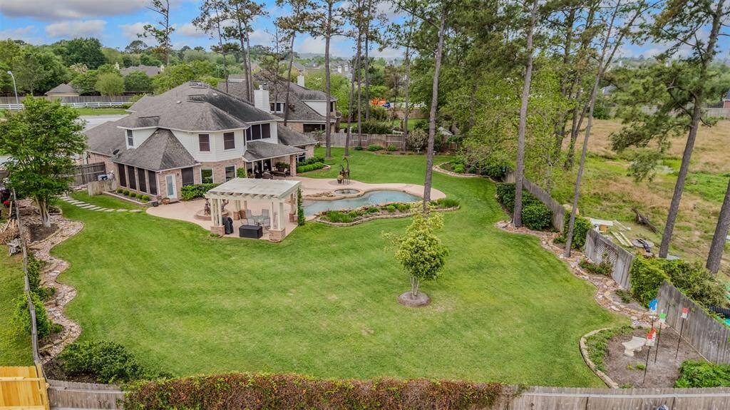 Aerial shot showing this expansive yard and all the landscaping. Fence replaced in 2017.