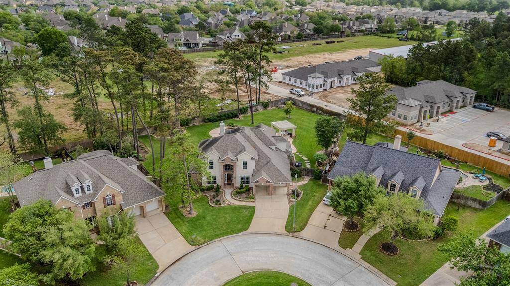 Aerial view of the front of home showing new construction of upcoming commercial business suites.