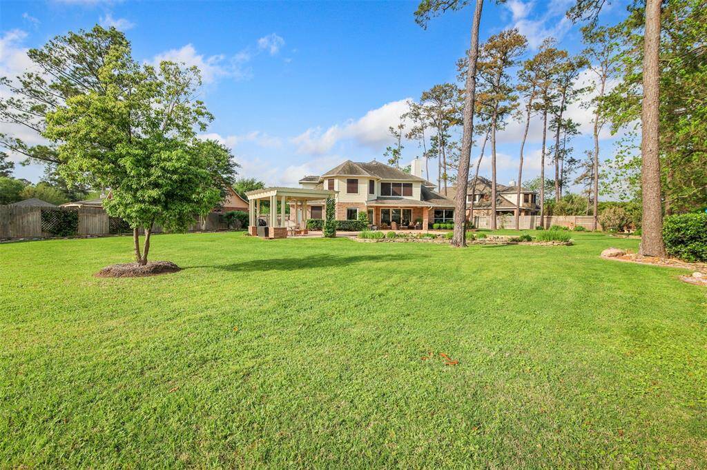 Ample yard and green space for the kids and pets to play. There is a light up in the pine trees that gives the effect of moonlight in the yard.