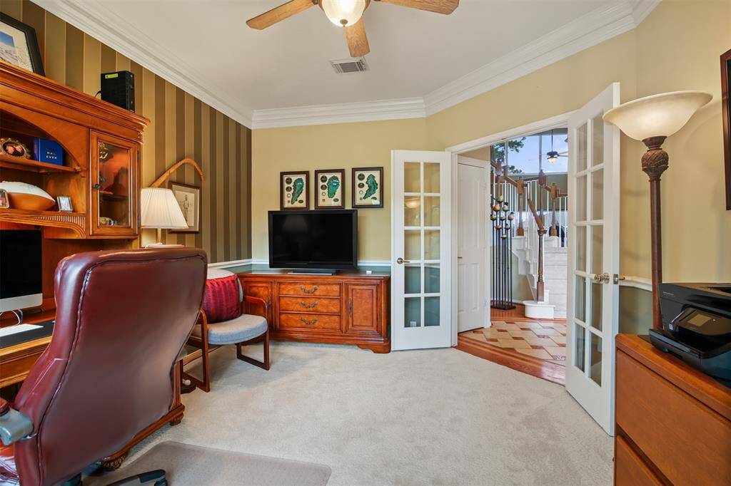 There are double french doors leading into the study off foyer.