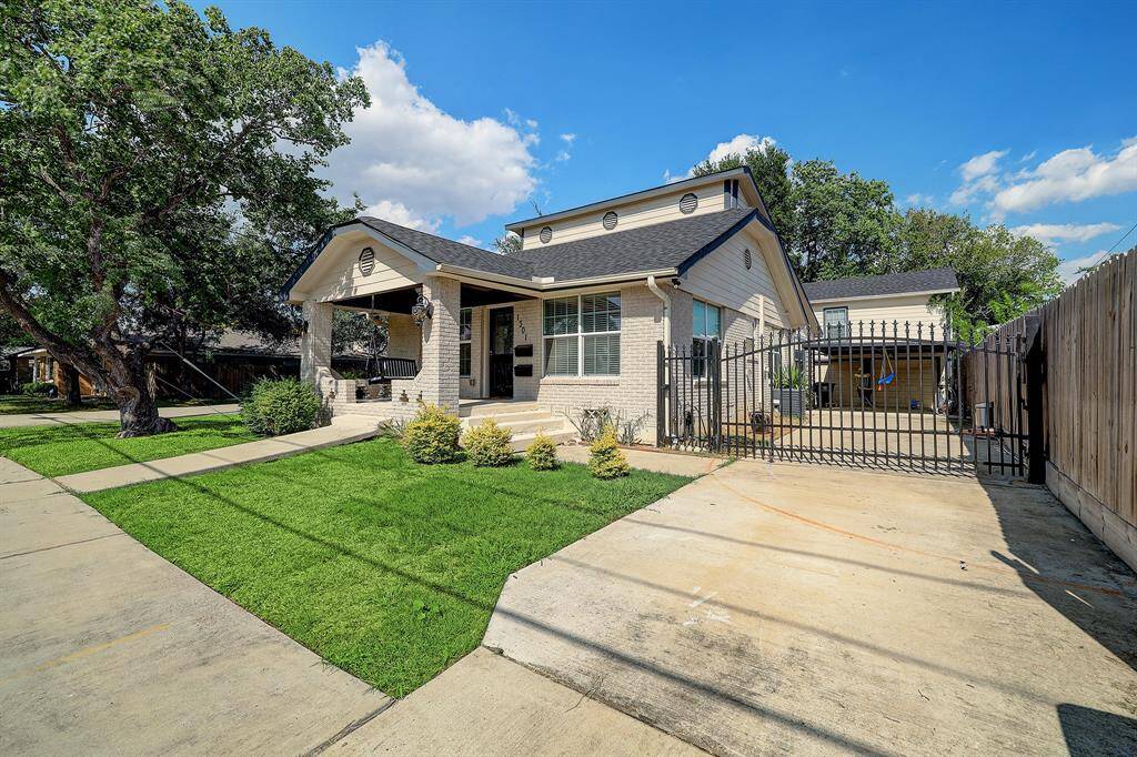 Extended driveway with automatic gate. Garage apartment is assigned to garage and main house tenant is assigned driveway.