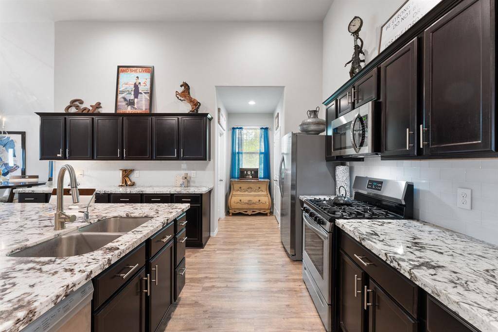 A well-appointed kitchen featuring an abundance of cabinet, offering generous storage space