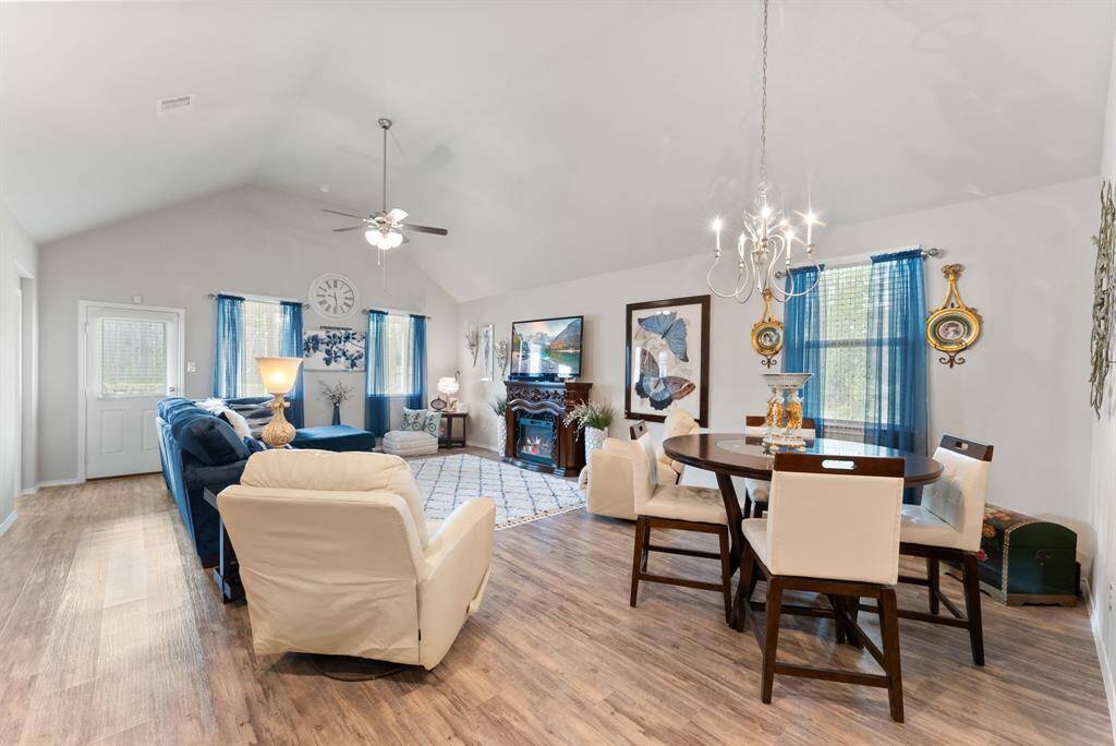 The breakfast area seamlessly overlooks the living room, offering a cozy spot to enjoy meals while staying connected with the heart of the home.