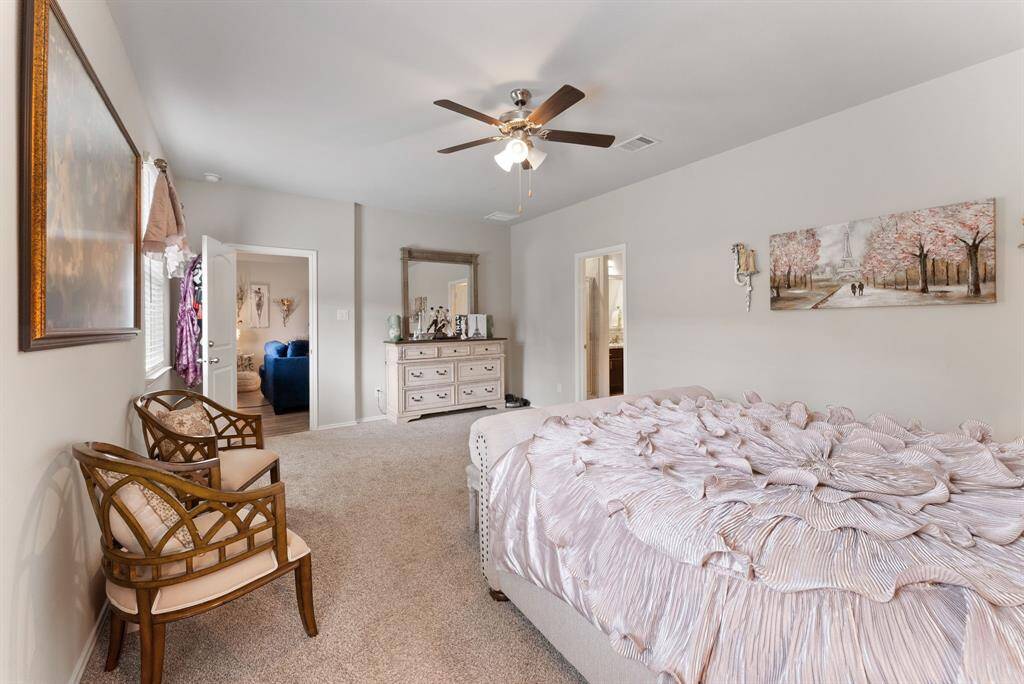 Another angle of the primary bedroom looking towards the living room