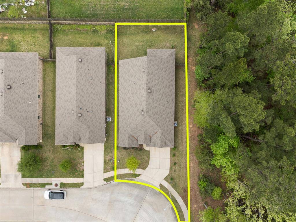 This aerial view features no neighboring properties on its right side, offering privacy