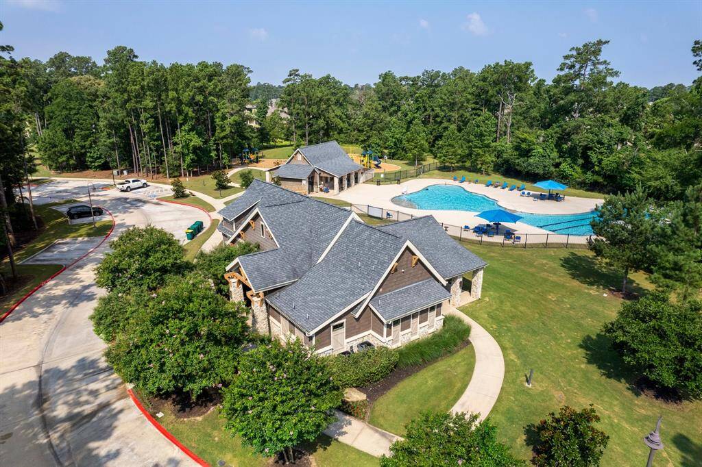 The neighborhood community center and pool serve as a vibrant hub for residents, offering a welcoming space for social gatherings, recreational activities, and family fun in a resort-like setting