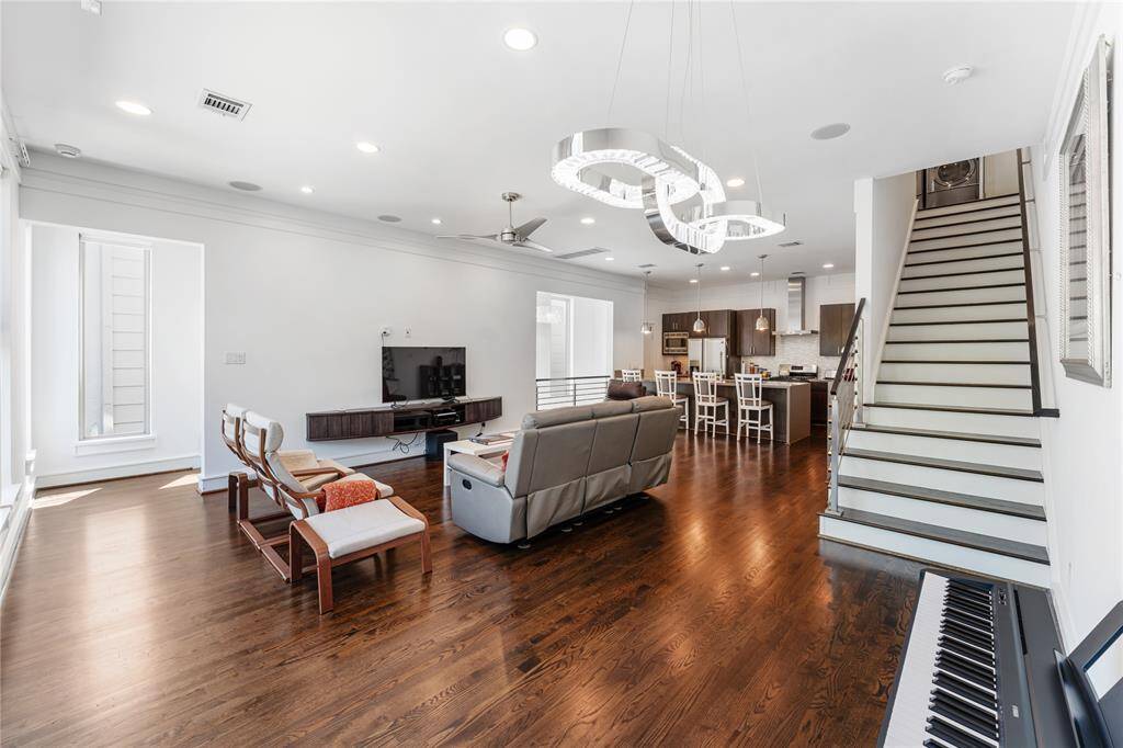Spacious living area with wood floors
