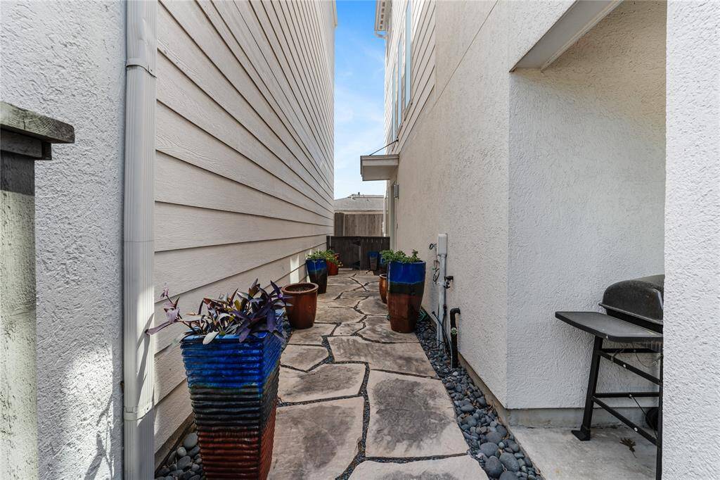 The stone-paved entrance provides privacy to the home entrance.