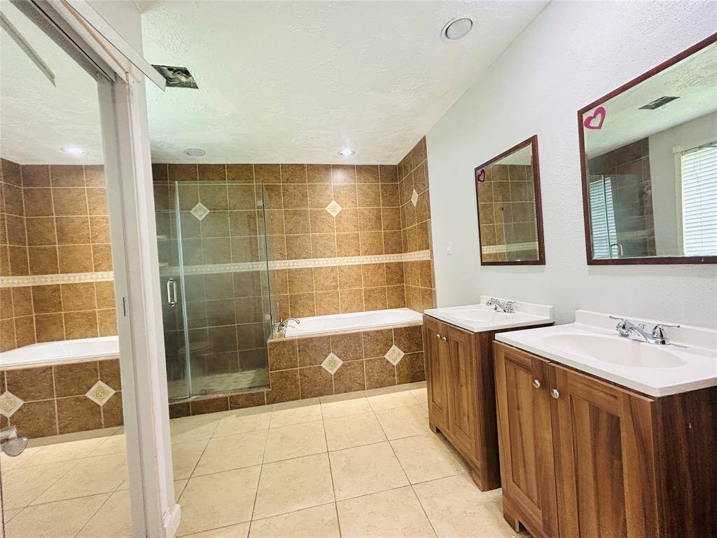 Separate sinks in the primary bathroom.