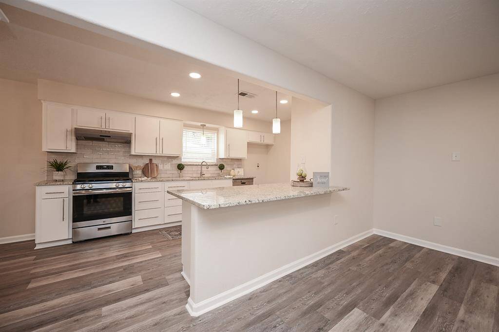 The kitchen is open to the family room and has a sit-up bar!