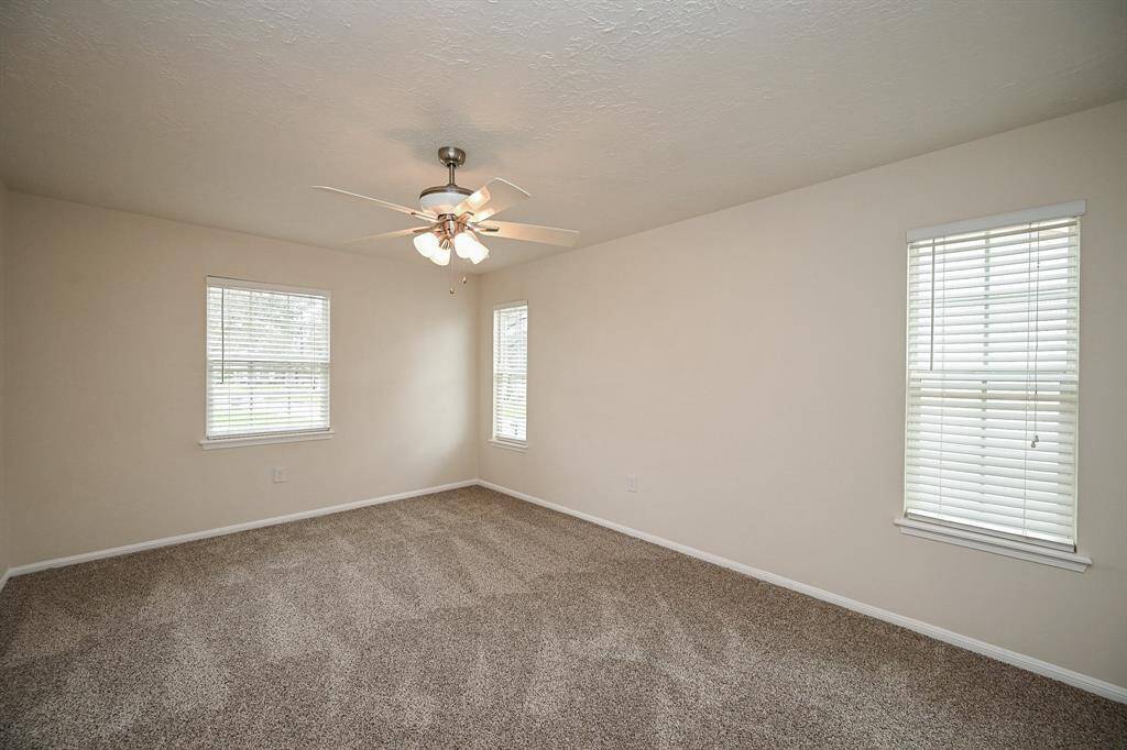 Primary Bedroom:  All 4 bedrooms have new carpet, window blinds, and ceiling fans!