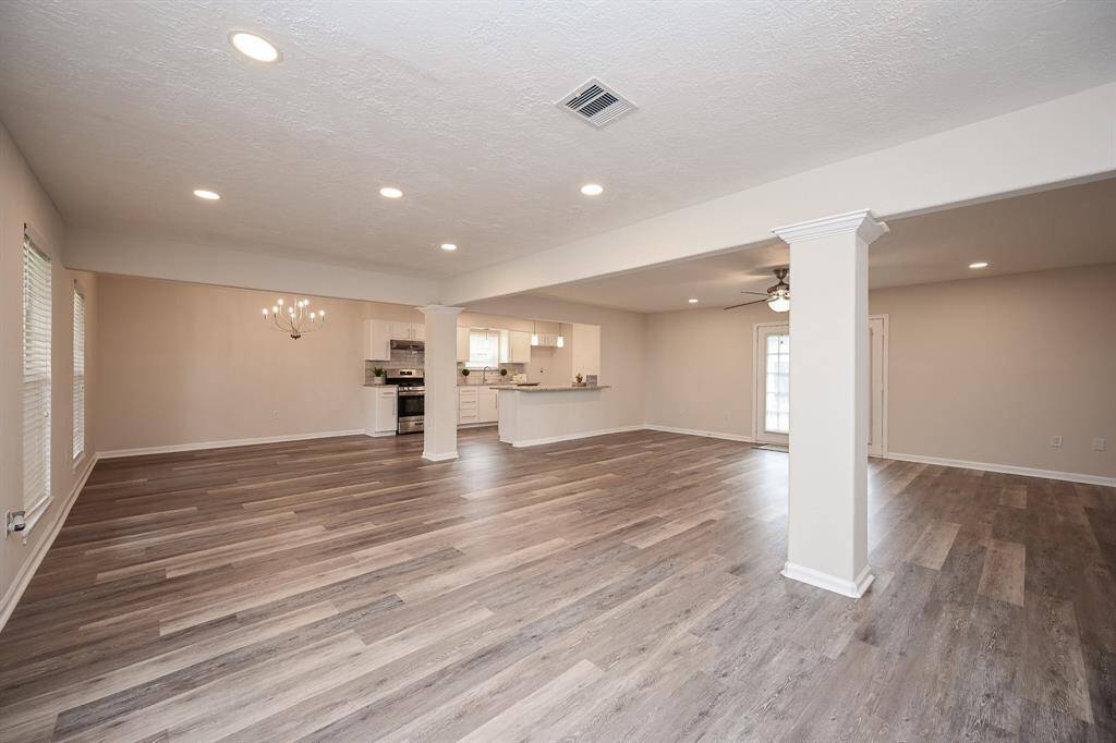 Opened floor plan with lots of recessed LED lighting, all ne flooring, and fresh paint!