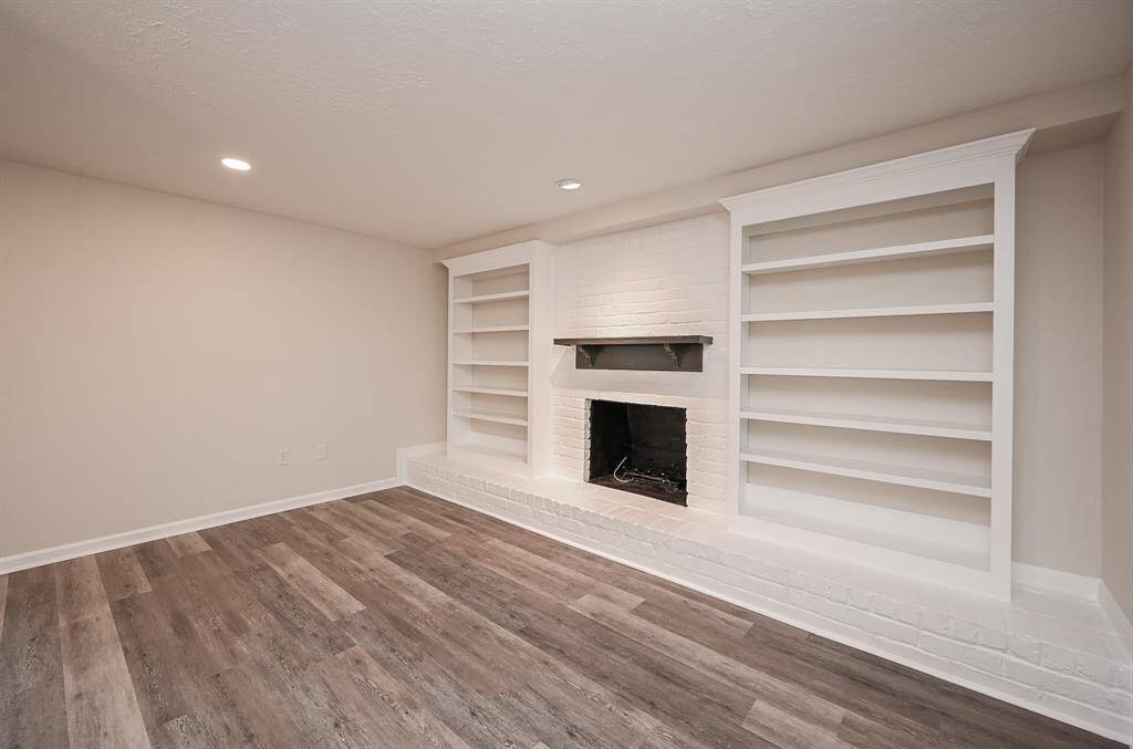 The gas fireplace has built in shelving on each side