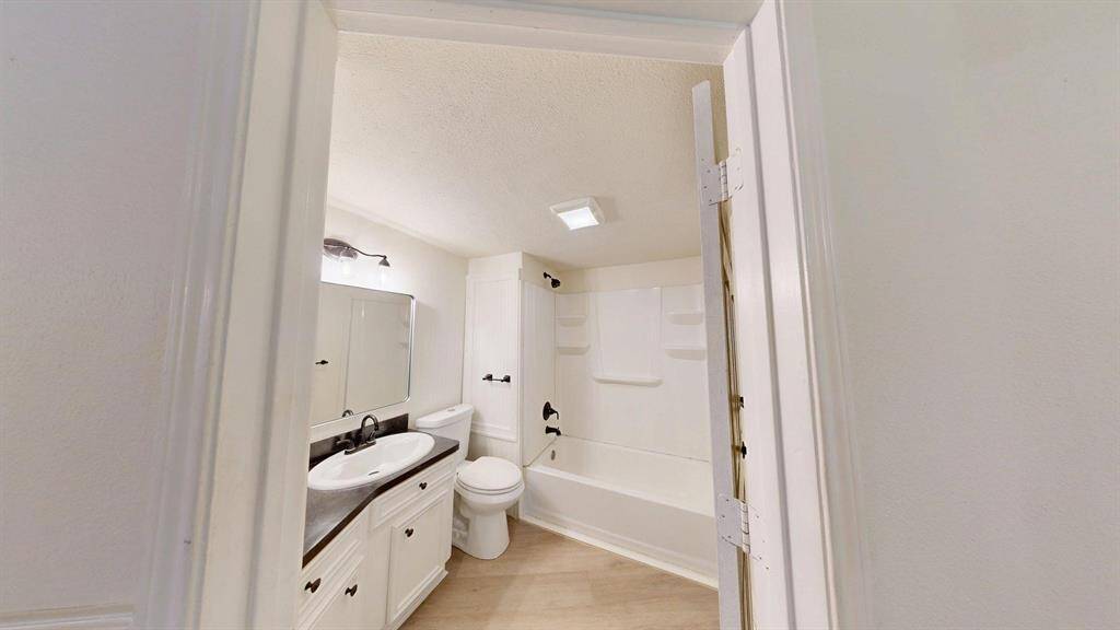 Downstairs bathroom with tub-shower combo