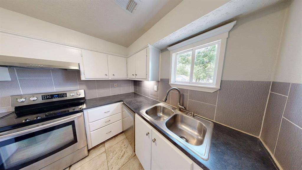 There is plenty of natural light coming in to the kitchen.