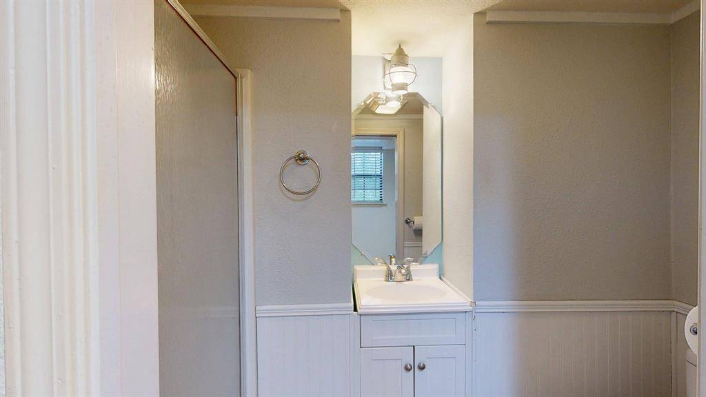 The bathroom at the center with a walk-in shower.