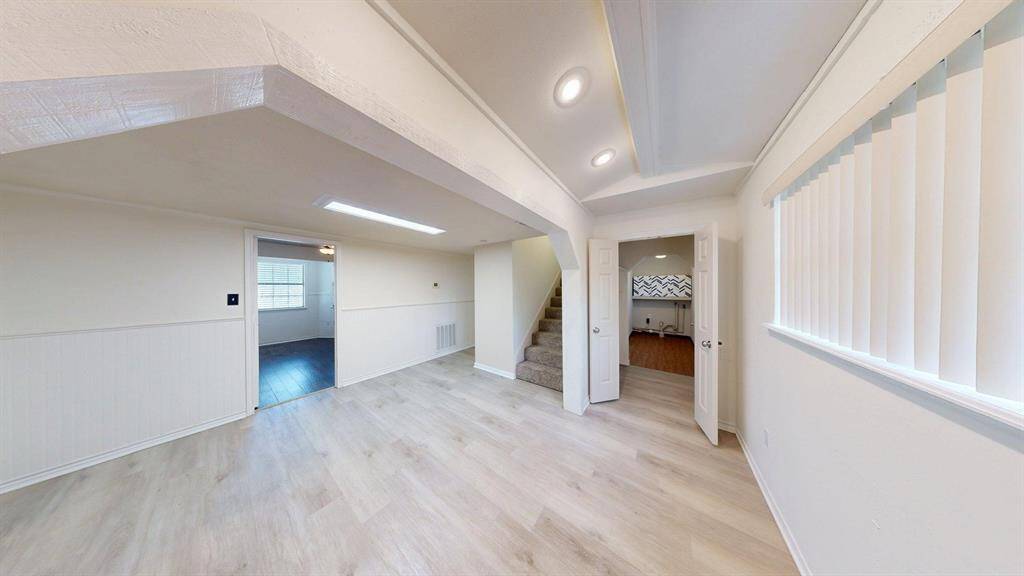 At the center you have the stairs to the second floor and to the right a door to the utility room