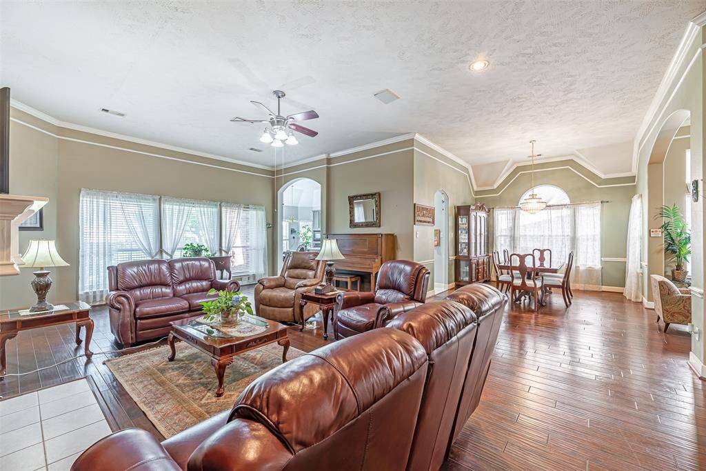 The family room has has views looking out into the backyard with large picture windows.