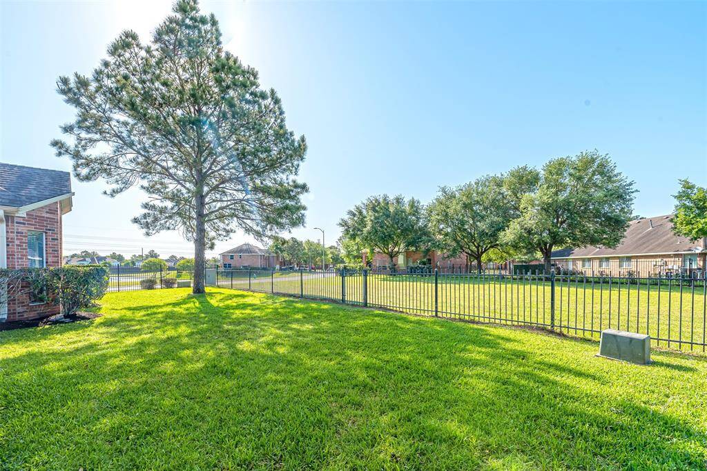 There is a large greenspace next to the home.