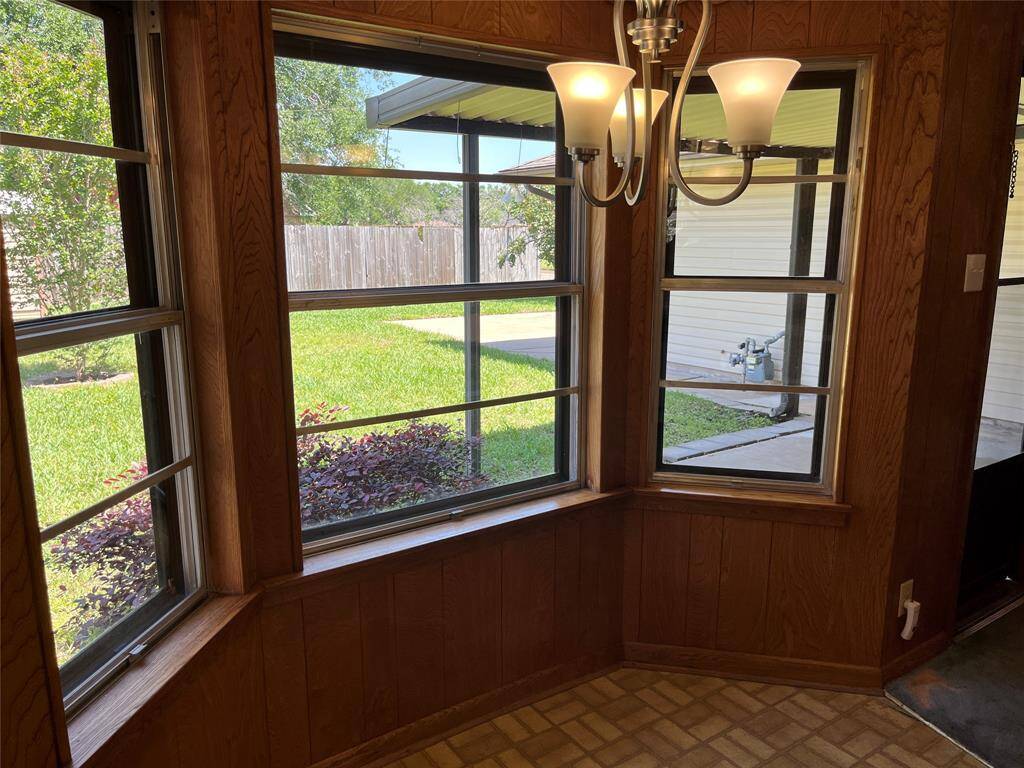 Here's your breakfast area with a cute bay window that overlooks the back yard and covered patio. Most of the windows have storm windows on the outside for extra energy-efficiency.