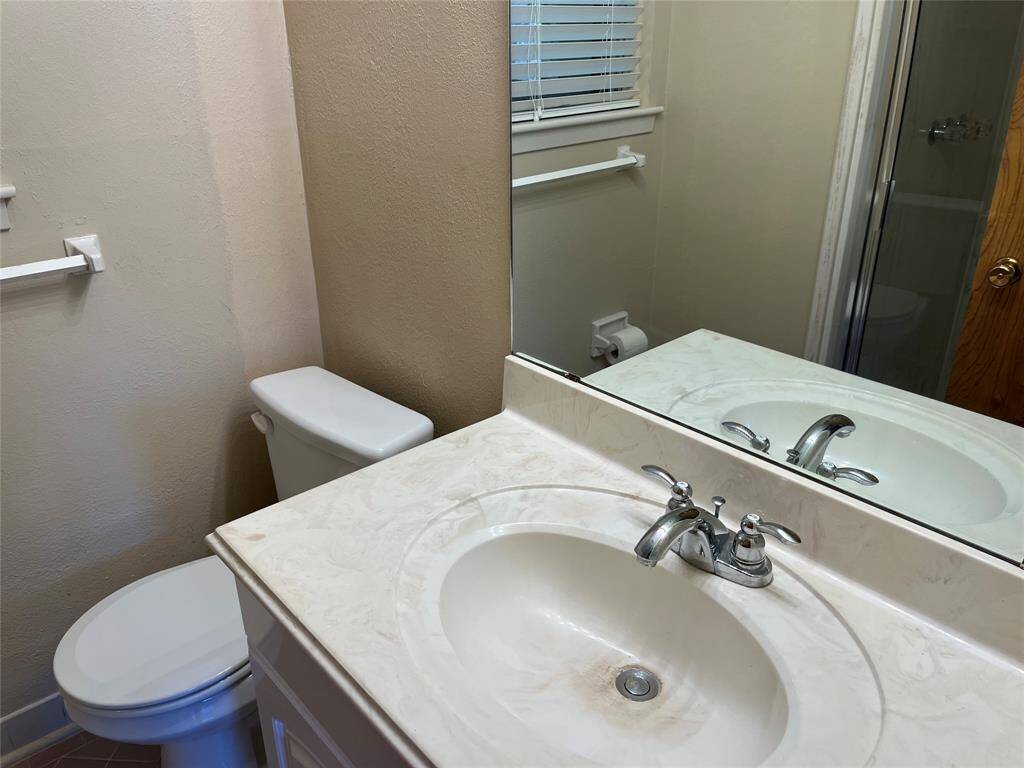 The primary bath has a cultured marble sink and cultured marble shower.  You can see the reflection behind us.