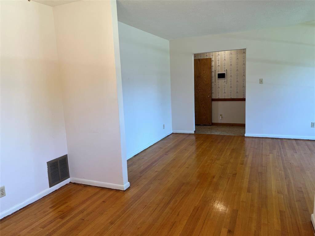 The hardwood floors have never been refinished and they would look amazing with a little update.