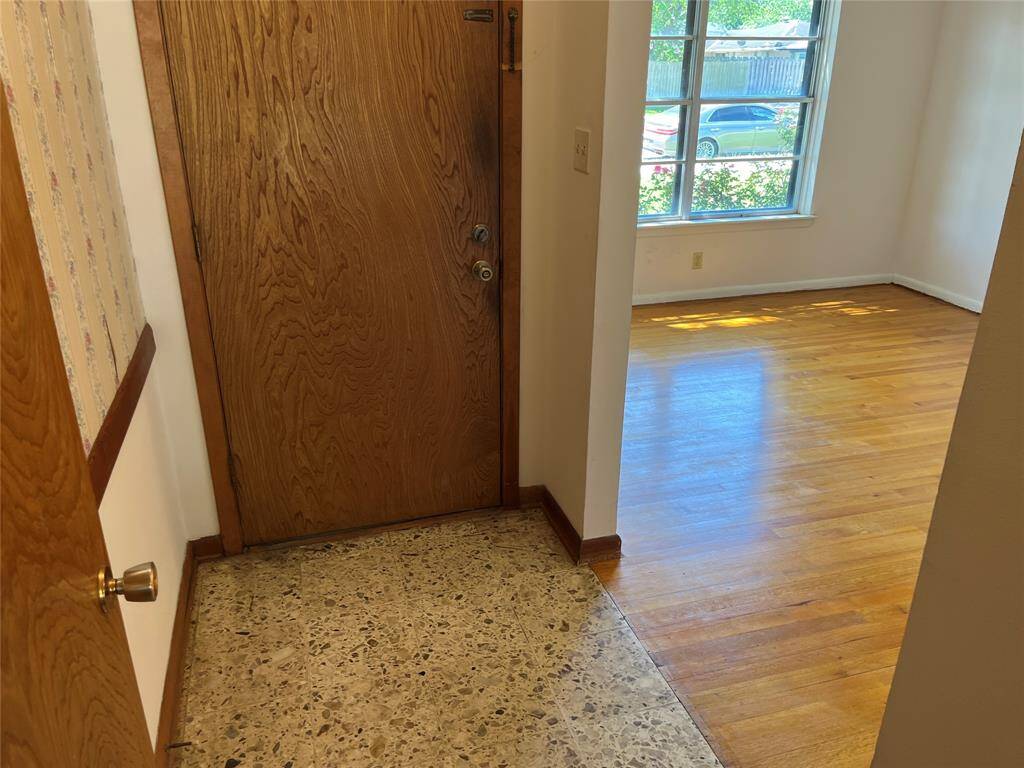 The foyer has vintage terrazzo floors.