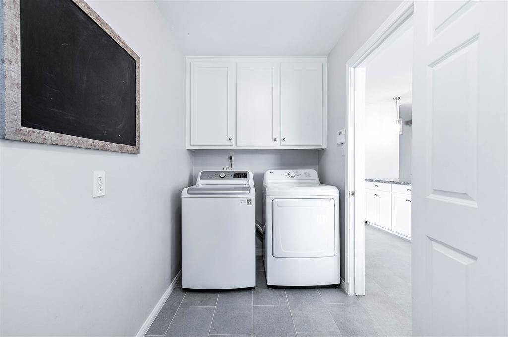 The utility room is tucked way behind a door between the kitchen and the breakfast nook.