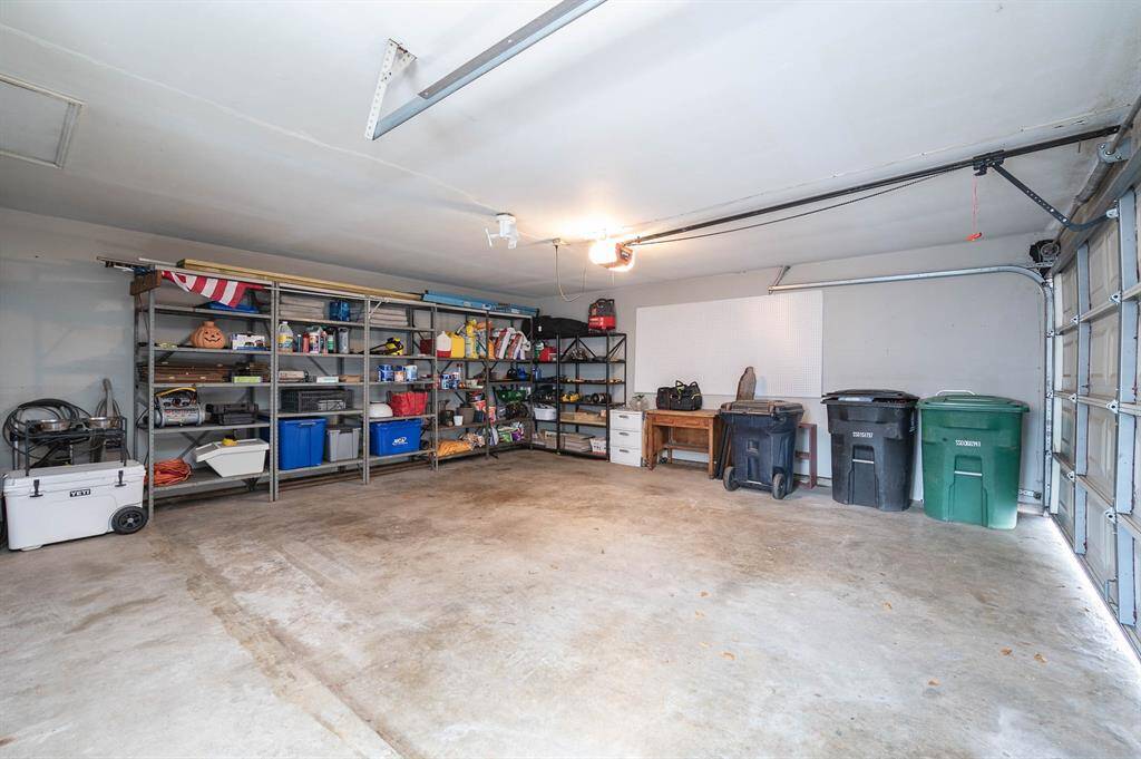 Spacious garage with room for additional storage.