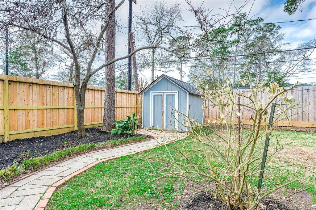 The backyard features a patio, good size yard, and a storage shed. Brand new fence also!