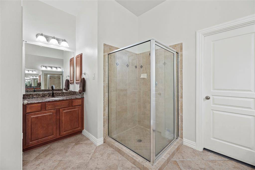 View of the second vanity and enclosed shower.