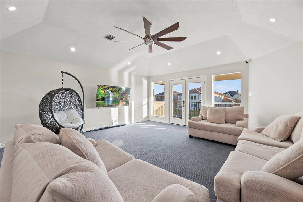 This game room also has direct access to the outside balcony.