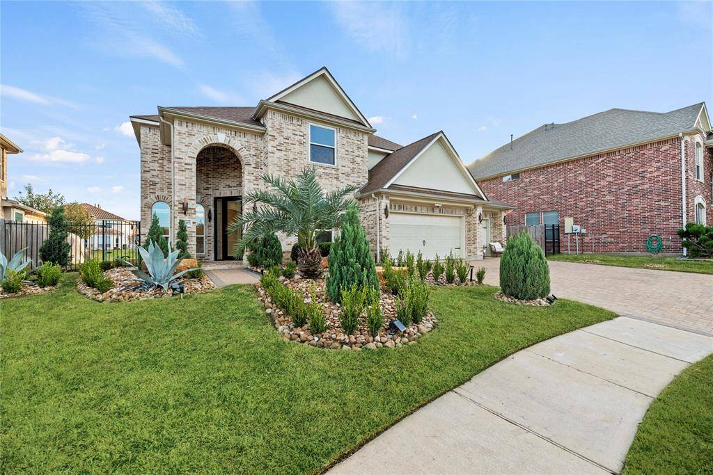 Lovely curb appeal with meticulous landscaping.