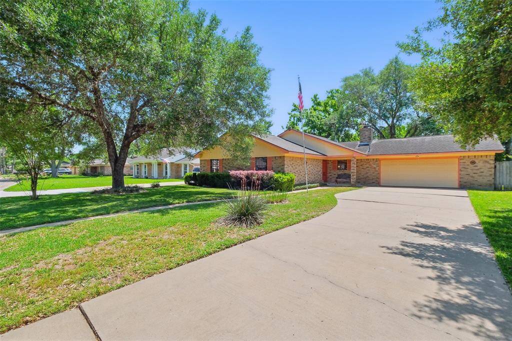 Lane Real Estate is offering 1805 Mulberry Drive in Richmond, Texas, for sale. This family home set back on the lot as seen from the street.