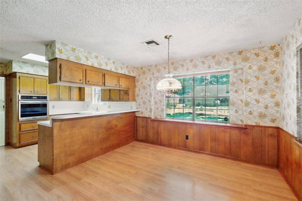 The Dining Room is conveniently adjacent to the Kitchen. A Breakfast/Serving Bar separates the two rooms.